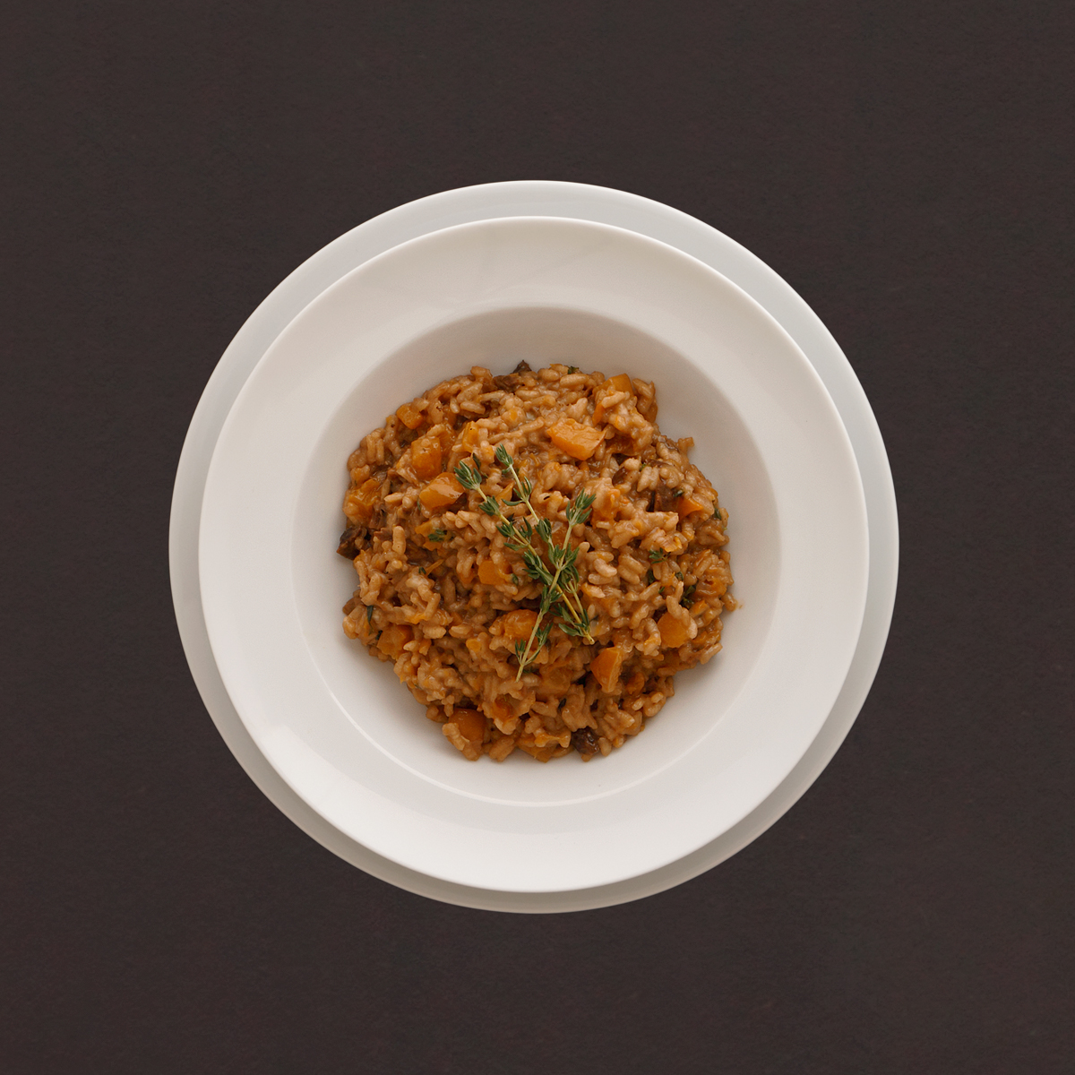 Kurbisrisotto Kürbisrisotto mit getrockneten Steinpilzen und Thymian